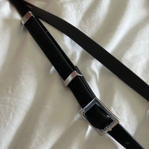 H&M black skinny belt with silver buckle, size XS. Gently used.